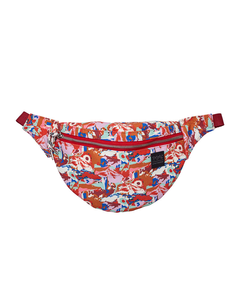 bolso-riñonera erupción con cierre delantero, cinta regulable, estampado original colorido destacando el rojo y naranjas, moda lentita, moda española, marca unisex