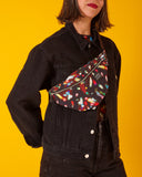 bolso-riñonera lux con cierre delantero, cinta regulable, estampado original de luces en movimiento colorido, moda lentita, moda española, marca unisex