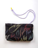 Bolsín neceser Brava x peSeta neceser llamas de colores, bolso de maquillaje, estampado original con llamas en colores sobre fondo negro. moda sostenible, hecho en España, producción local